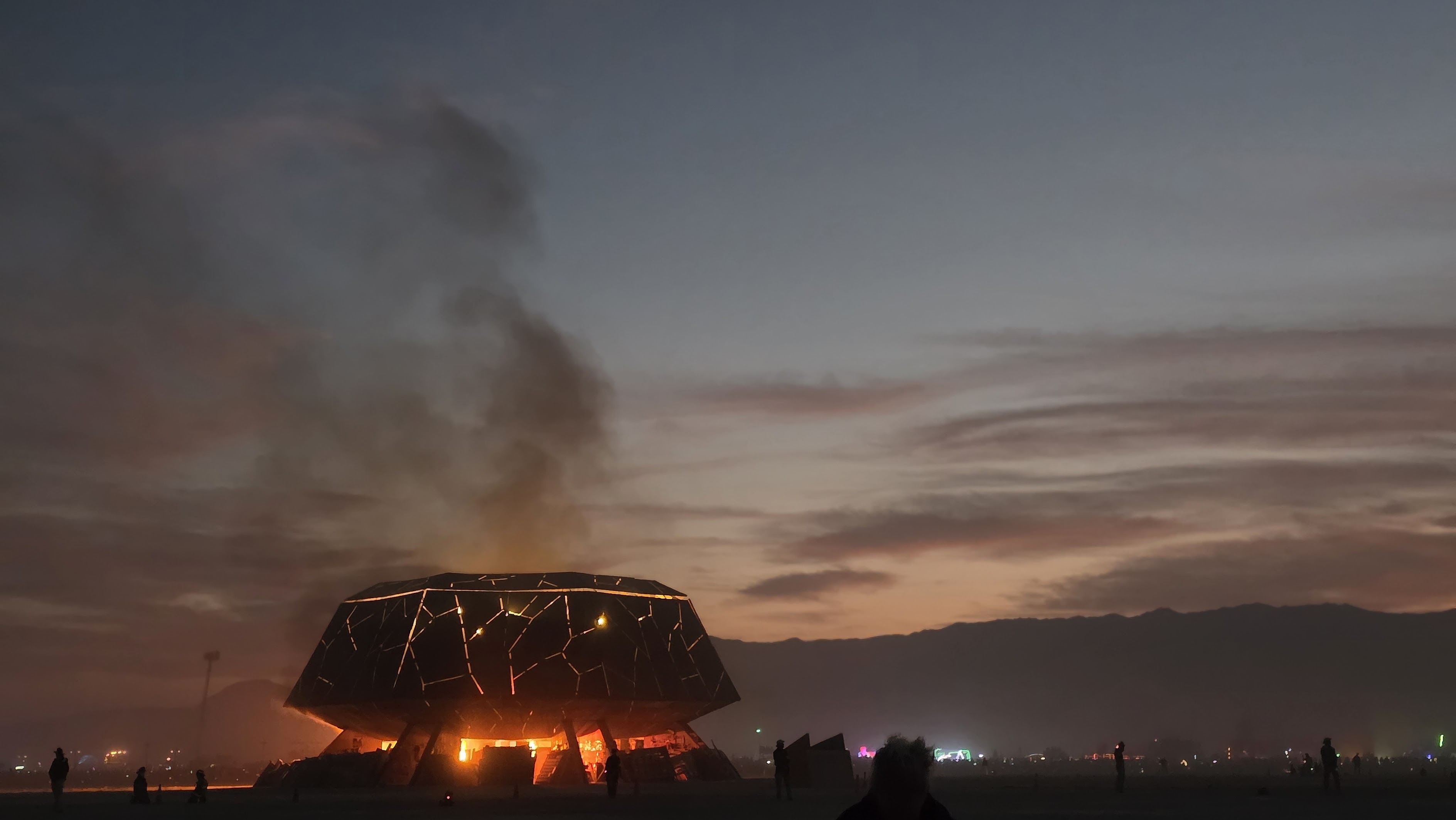 The Temple burning at twilight