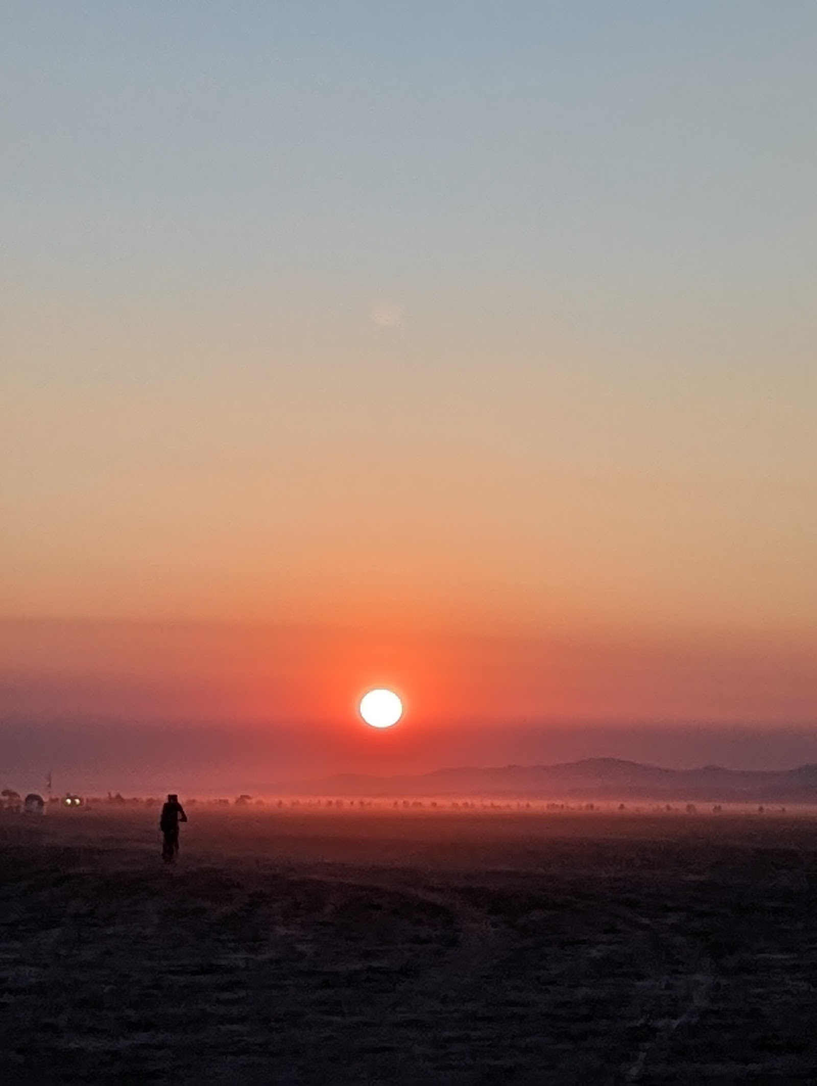 Sunset silhouette over the open playa